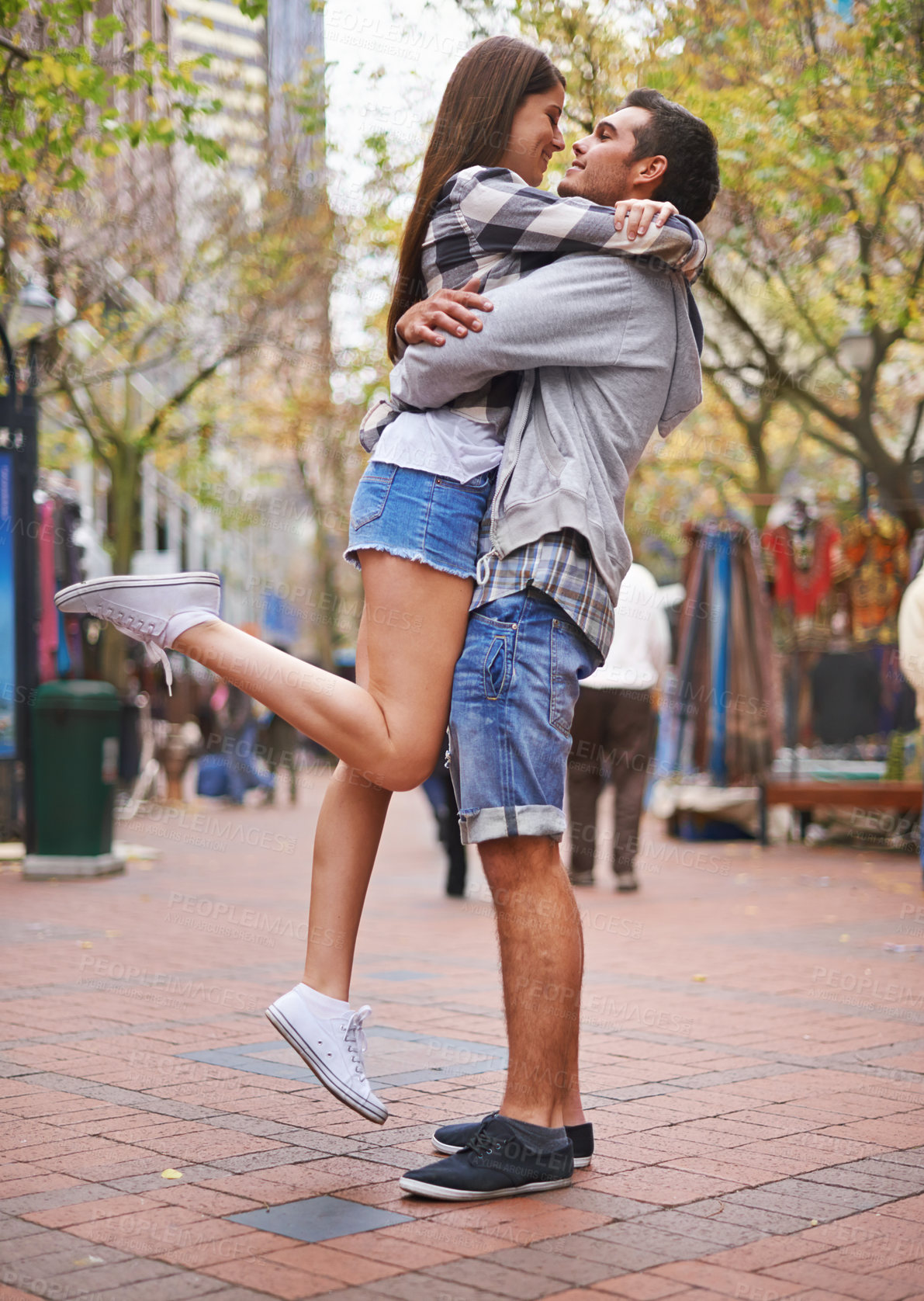 Buy stock photo Couple, hug and outdoor in city, happy and excited with love, bonding together and romantic relationship. Cape town, embrace and enjoy with boyfriend and girlfriend in street, summer and dating