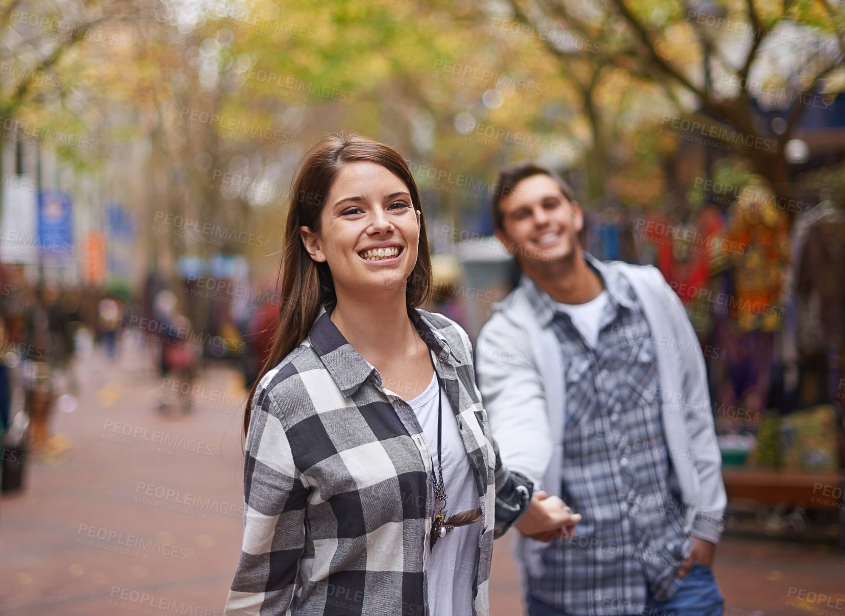 Buy stock photo Happy couple, portrait and woman walking, holding hands and lead partner on city journey, morning trip or tour of urban Paris. Love, tourism town and people bonding together on relax commute