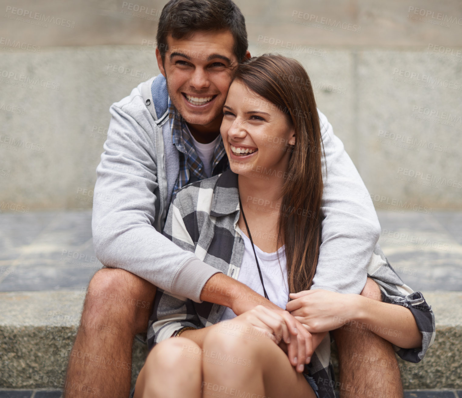 Buy stock photo Laugh, stairs and relax couple hug, bonding and enjoy date on marriage honeymoon, Valentines Day or anniversary. Steps, love and happy urban man, woman or people look at funny view, comedy or humour