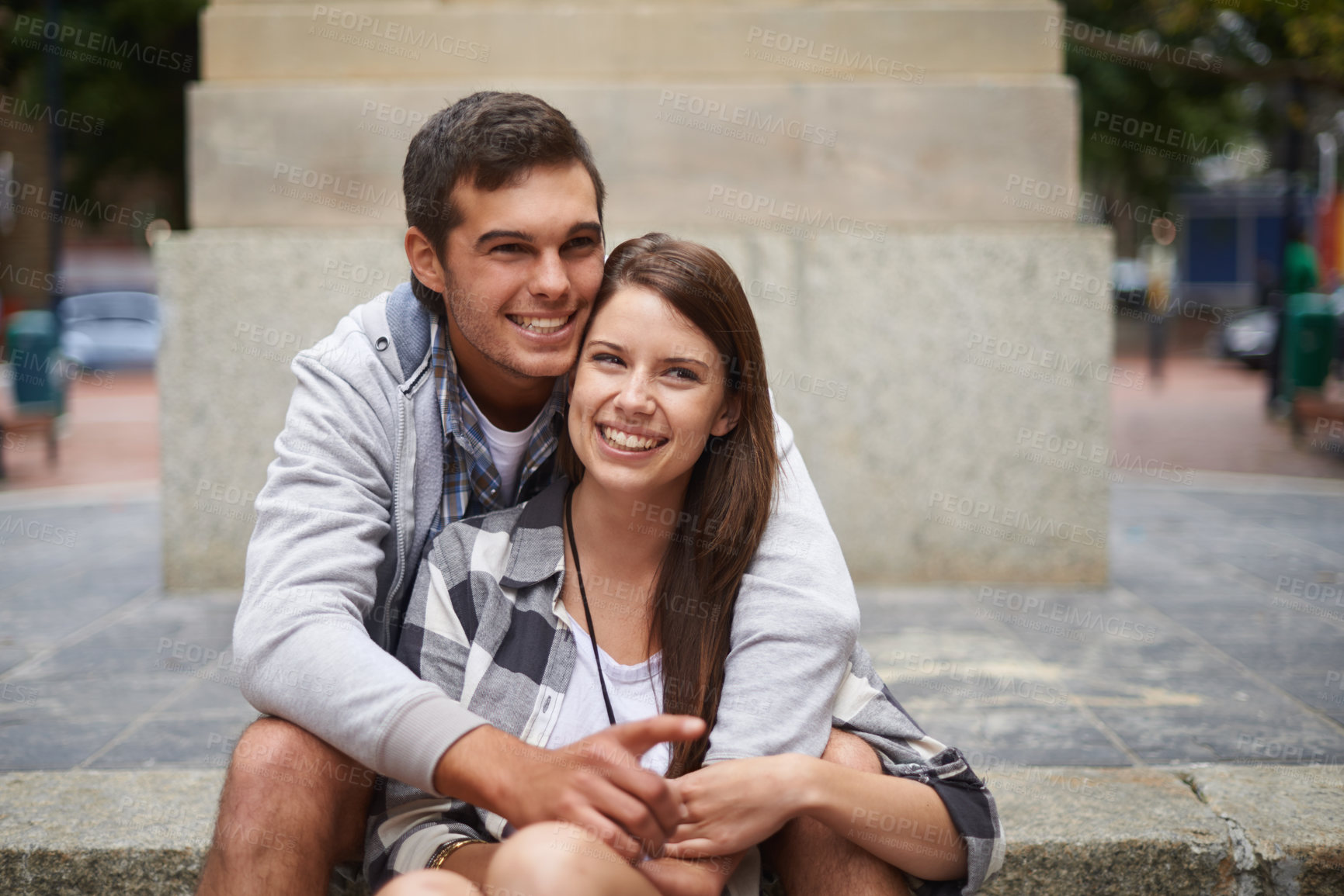 Buy stock photo Travel, love and smile with couple in city together for adventure, holiday or sightseeing overseas. Hugging, street or sidewalk with happy young man and woman outdoor for tourism or vacation abroad