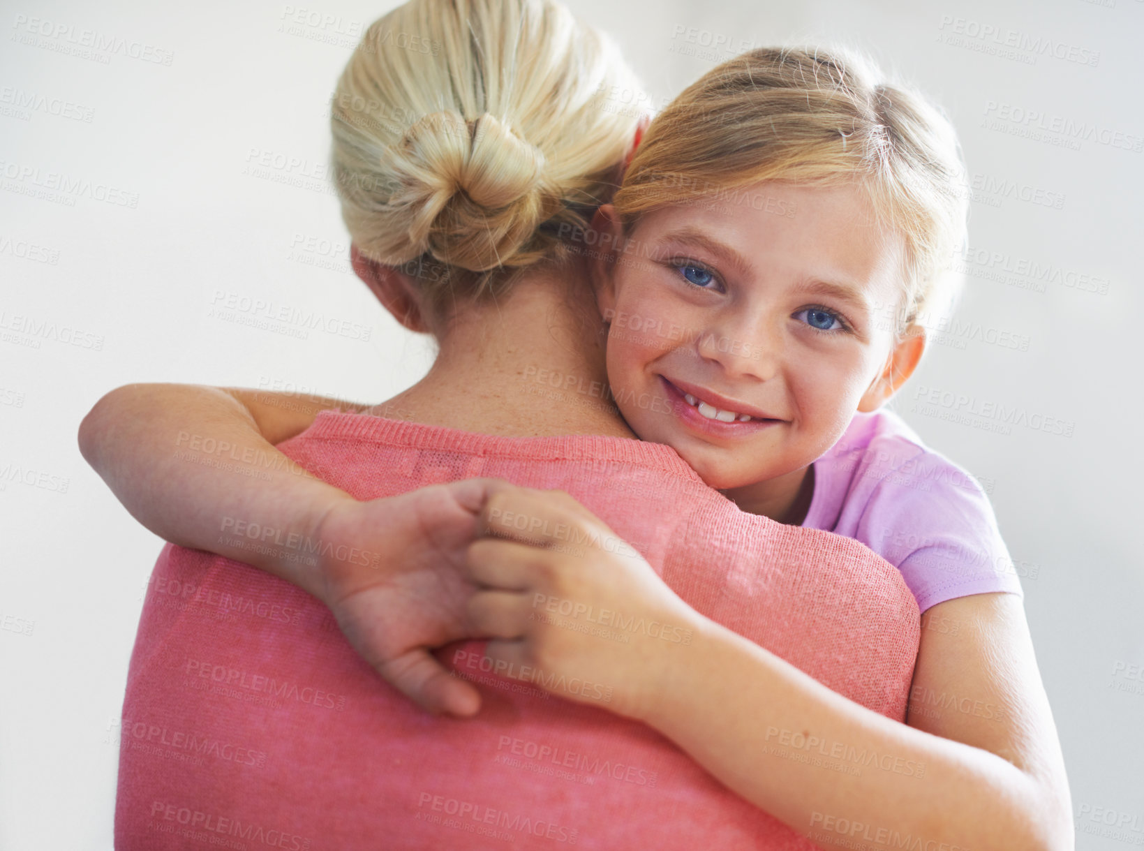 Buy stock photo Mother, girl and hug in portrait, bonding and love in childhood by single parent in studio. Daughter, mommy and caring together on white background, embracing and security or enjoying connection