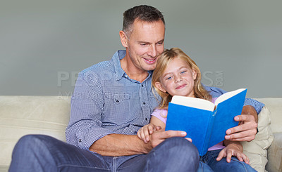 Buy stock photo Father, child and reading book for knowledge at home, story and fantasy fiction for education. Daddy, daughter and bonding together on sofa, literacy and support for language development in childhood