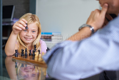 Buy stock photo Family, happy and daughter playing chess together in home for strategy development, bonding or fun. Love, growth or board game with parent and girl child learning about competition or challenge