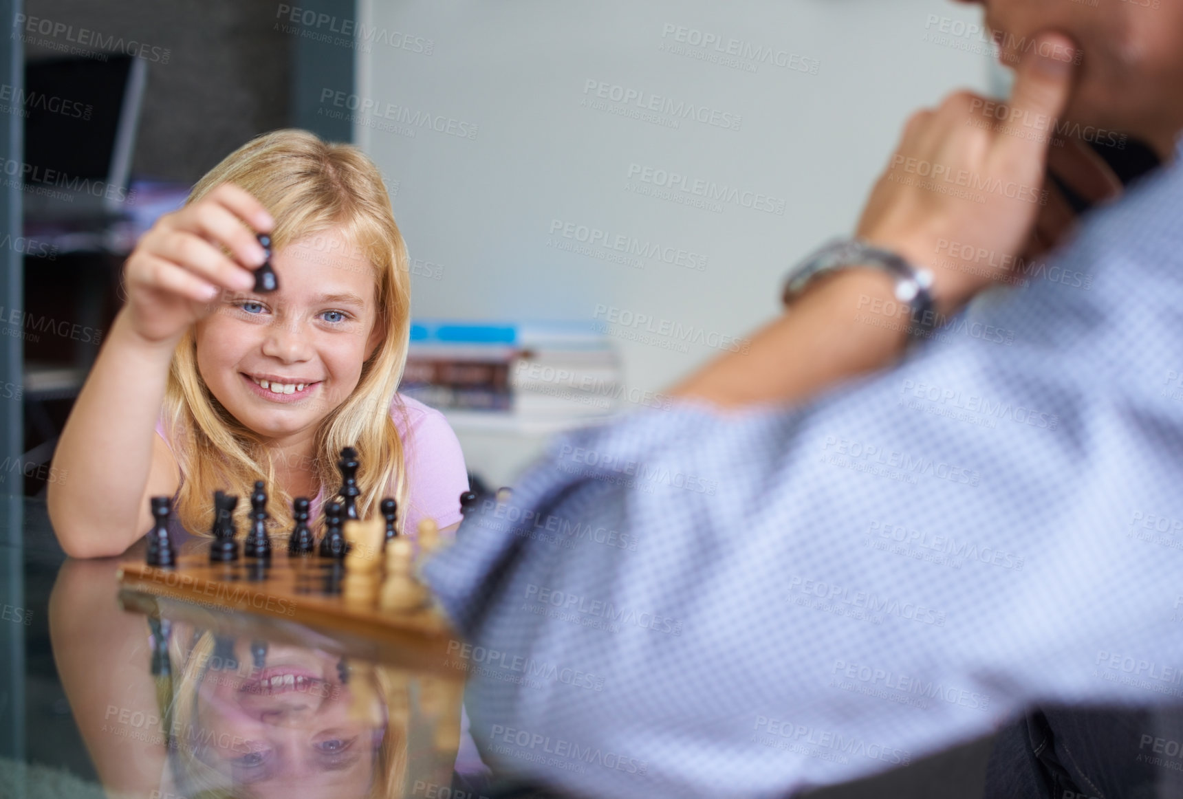Buy stock photo Family, happy and daughter playing chess together in home for strategy development, bonding or fun. Love, growth or board game with parent and girl child learning about competition or challenge