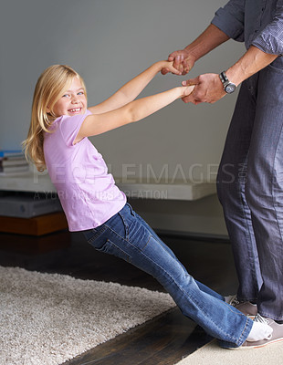 Buy stock photo Shot of a little girl and her father at home