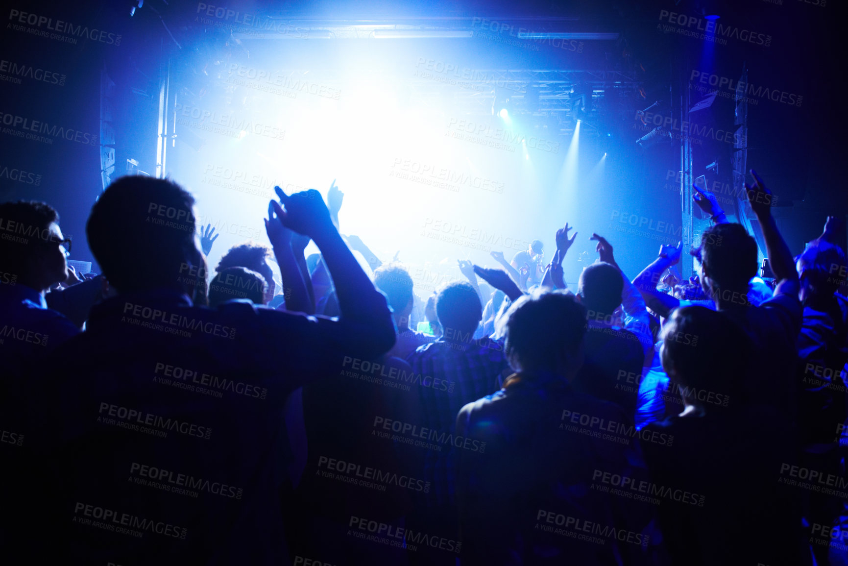 Buy stock photo A crowd of people cheering the band on st