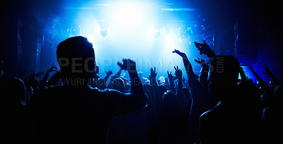 Buy stock photo A crowd of people watching a band play on stage at a nightclub. This concert was created for the sole purpose of this photo shoot, featuring 300 models and 3 live bands. All people in this shoot are model released.