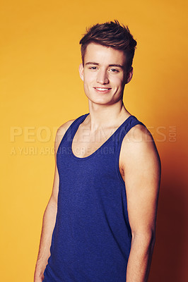 Buy stock photo Studio shot of young smiling man in casual clothes