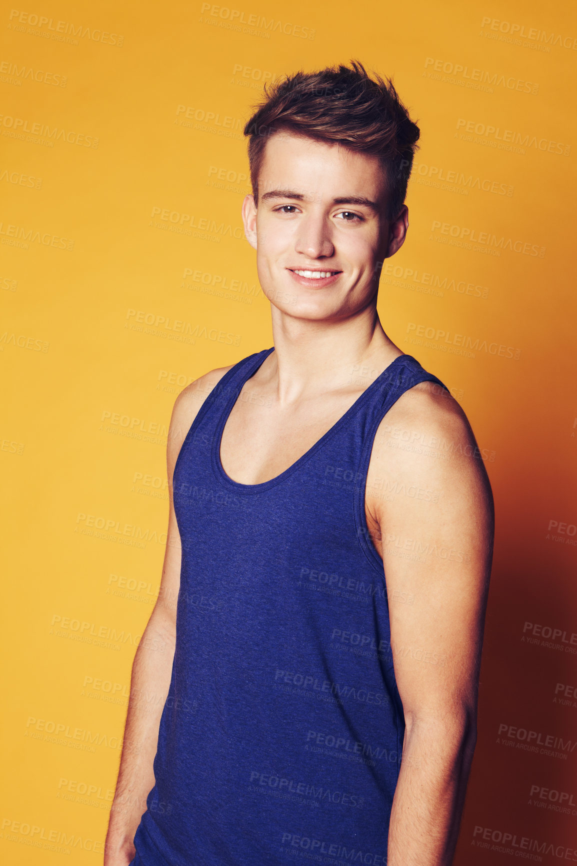 Buy stock photo Studio shot of young smiling man in casual clothes