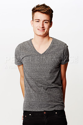 Buy stock photo Portrait, smile and man with fashion, casual outfit and confident guy on a white studio background. Person, happy and model with t shirt, cool and stylish clothes with student, aesthetic and joyful
