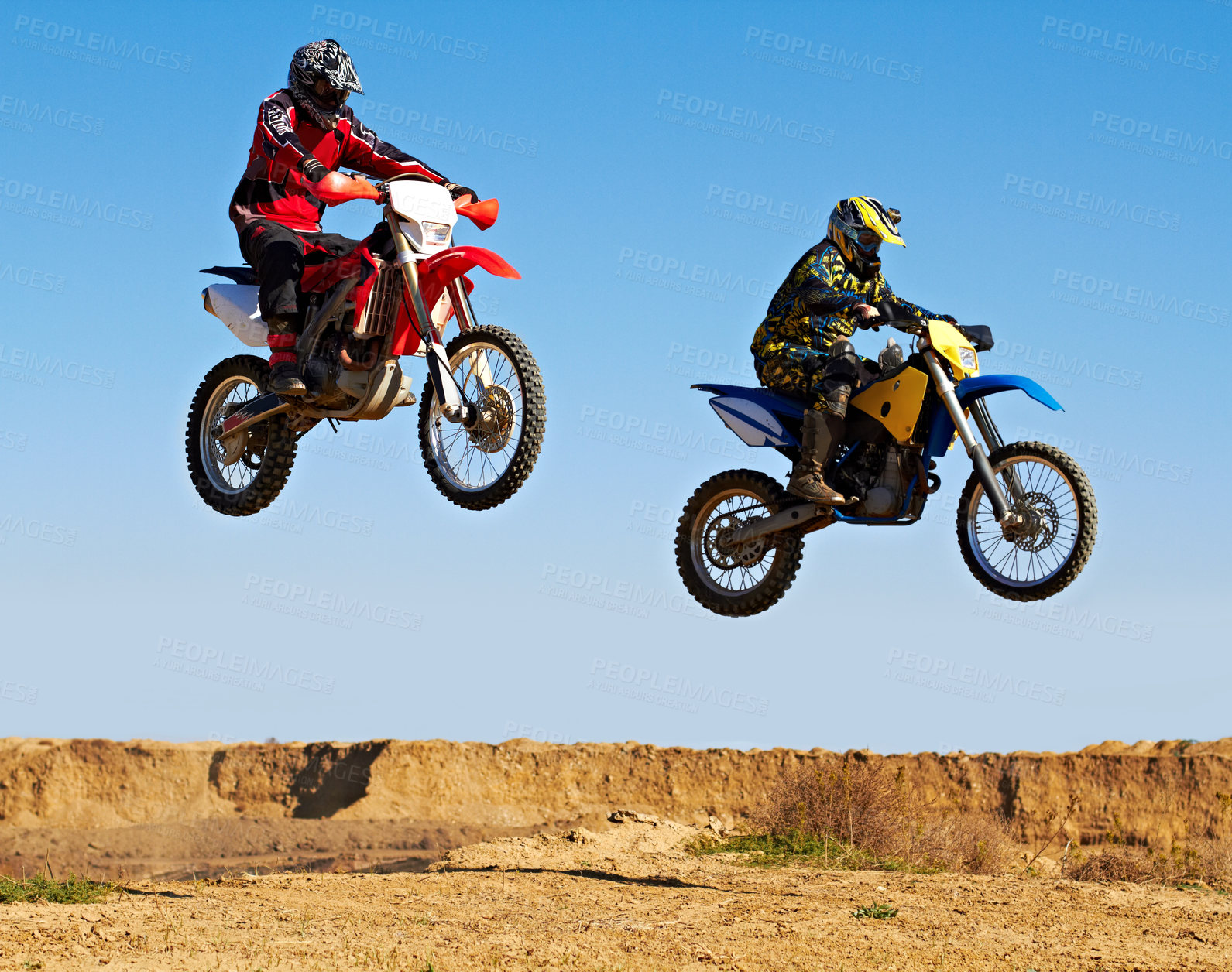 Buy stock photo Shot of dirtbike racers
