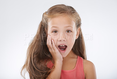 Buy stock photo Child, portrait and hand for surprise news in studio for announcement, information or review. Female person, face and shocked on white background for giveaway secret as wow mockup, winner or drama