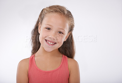 Buy stock photo Child, girl and portrait or smile in studio with confidence, positive attitude and carefree youth. Kid, face and happiness with calm expression, mock up space and casual outfit on white background