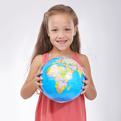 Buy stock photo Child, portrait and globe in studio with world, planets and city for education, geography and happy. Student, girl kid and travel map with smile for earth day support or lesson on white background