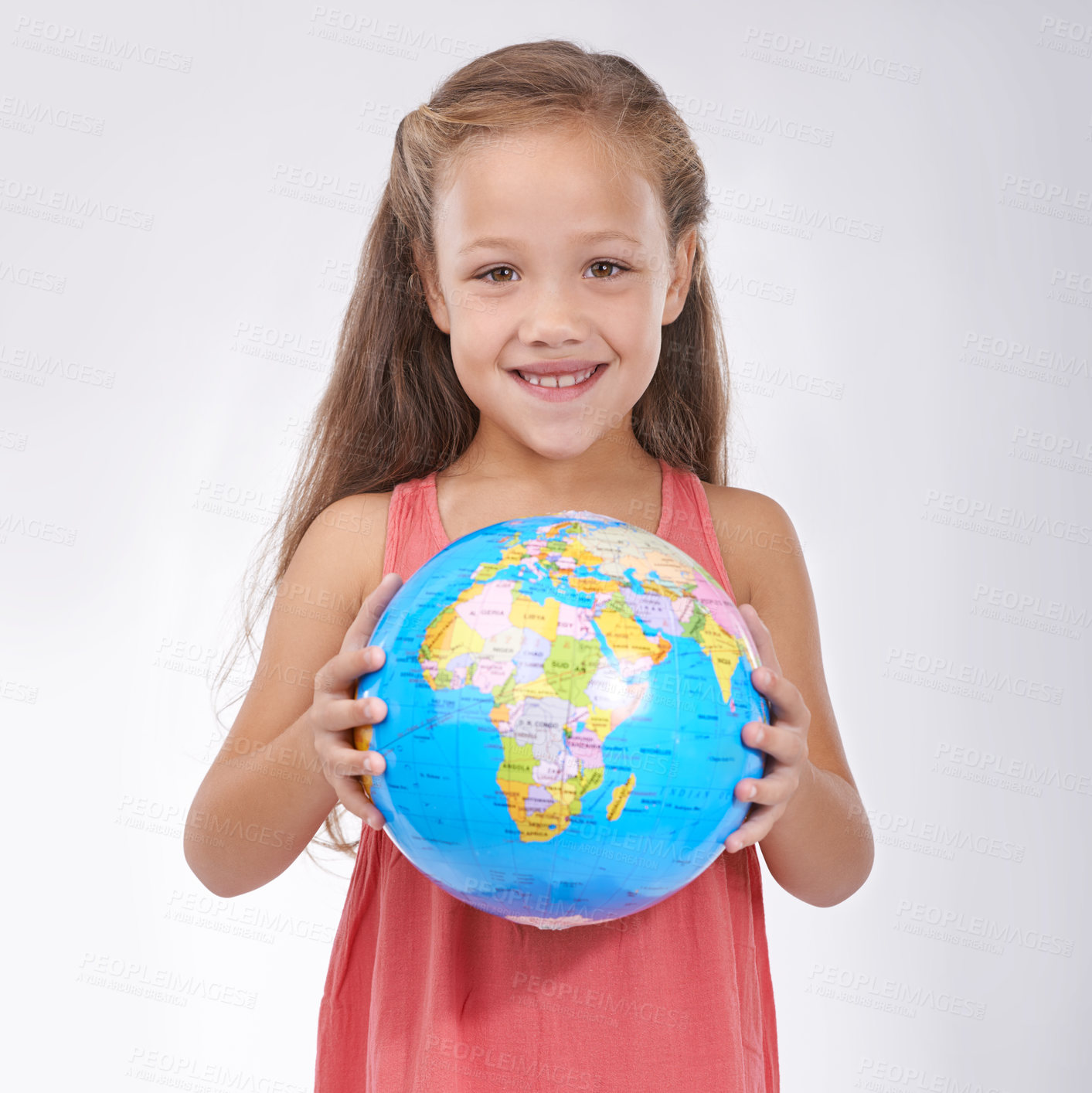 Buy stock photo Child, portrait and globe in studio with world, planets and city for education, geography and happy. Student, girl kid and travel map with smile for earth day support or lesson on white background