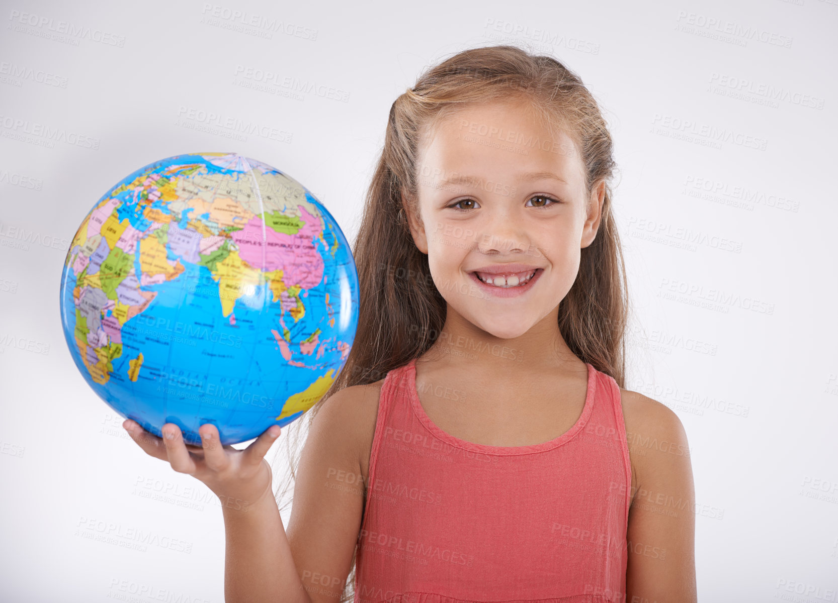 Buy stock photo Girl, child and globe with map for travel, smile in portrait for geography, international and toys on white background. Learning of world, education and development, adventure and student in studio