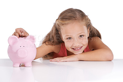 Buy stock photo Shot of a cute young girl with a piggybank