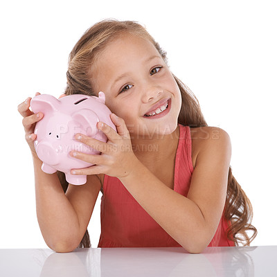 Buy stock photo Girl child, piggy bank and listen for money, studio and check with pride for savings by white background. Confused kid, portrait and animal toys for coins, cash or learning for financial education