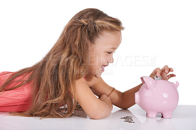 Buy stock photo Girl child, piggy bank and coins for saving, studio or thinking with smile for investing by white background. Confused kid, container or animal toys for money, cash or happy for financial education