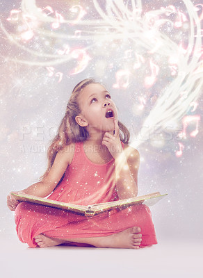 Buy stock photo Child, book and magic fantasy or creativity for music listen or storytelling dream, sound or imagination. Female person, kid and whimsical notes or white background in studio, supernatural or mockup