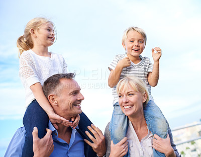 Buy stock photo Smile, piggy back and parents with kids on outdoor adventure, vacation and travel on blue sky. Relax, sunshine and family, happy children with with mom and dad on summer holiday fun with support.