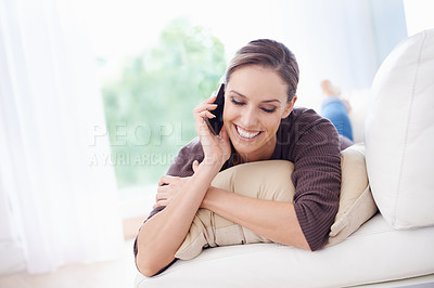 Buy stock photo Woman, smile and relax on sofa for phone call, communication and mobile networking at home. Happy lady, smartphone and audio contact for conversation, gossip and chat to digital connection in lounge