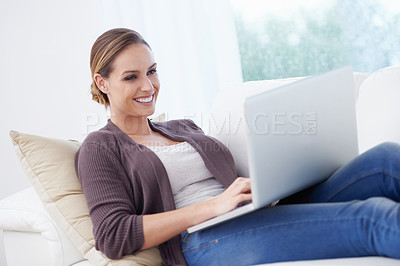 Buy stock photo Woman, remote work and laptop to relax on sofa for blog post, social media or reading digital research. Happy freelancer, computer or download movie subscription, online shopping or elearning at home