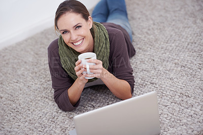Buy stock photo Woman, laptop and relax in portrait with coffee, happy with tech and streaming online for video or movie with internet at home. Connect, film or tv show, carpet or floor for entertainment and drink