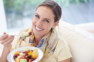 Buy stock photo Food, happy woman in portrait and fruit in salad for diet, organic meal and relax on sofa with smile for weight loss. Vegan, gut health and wellness, healthy eating for nutrition with vitamins