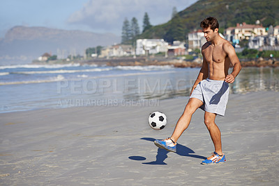 Buy stock photo Man, beach and playing with soccer ball for game, sports or exercise in outdoor hobby, training or practice. Young male person or football player on ocean coast for match or cardio workout by seaside