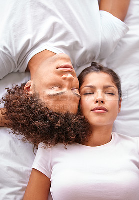 Buy stock photo Sleeping, duvet and face of couple in bedroom for comfort, cozy nap and rest with eyes closed in Puerto Rico home. Bed, fatigue and top view of man, woman or people sleep with calm, peace or wellness