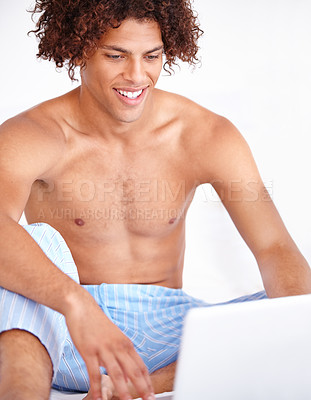 Buy stock photo Man, laptop and relaxing in bed on technology, blog and subscription for movie at home. Male person, website and internet connection for online entertainment, search and scroll on streaming service