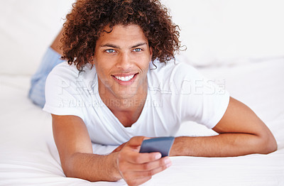 Buy stock photo Man, remote control and watching tv in bed, relaxing and entertainment on cable show at home. Male person, bedroom and broadcast channel or comedy, subscription and streaming service for program