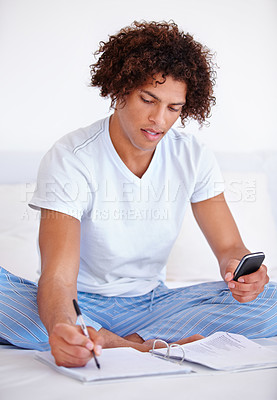 Buy stock photo Working, man in bed and cellphone for work from home, writing and sitting in pyjamas for freelance job. Technology, entrepreneur and remote worker for online job, documents and business projects
