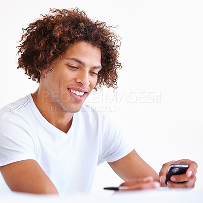 Buy stock photo Man, phone and writing notes for message or reminder in studio, email and information on white background. Male person, contact and networking or online research, tech and connection to internet