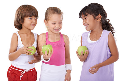 Buy stock photo Laughing, apple or happy kids with nutrition, wellness or healthy diet in studio isolated on white background. Funny, fibre or group of a young children with natural fruits for vitamin c with smile