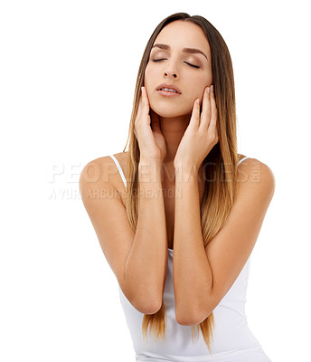 Buy stock photo A young woman looking at the camera with her hands next to her face