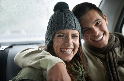 Buy stock photo A young couple sitting in their car while it rains