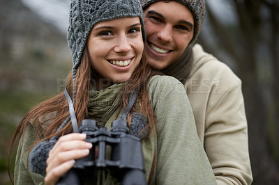 Buy stock photo Portrait, binocular and happy couple hiking on nature journey, travel adventure or forest jungle. Marriage, love and face of people smile for outdoor trekking, bird watching or camping trip in woods