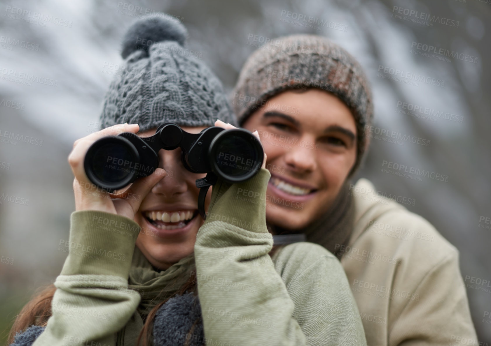 Buy stock photo Binoculars, nature and happy couple in portrait for journey, adventure in hiking or carbon footprint travel. Face of young man and woman with outdoor gear for birdwatching in winter, nature or woods