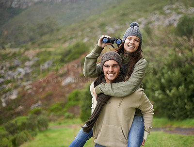 Buy stock photo Hiking portrait, binocular or happy couple on piggyback ride, have fun and enjoy mountain climbing journey in nature. Marriage, love or people bond on travel adventure, trekking or bird watching trip