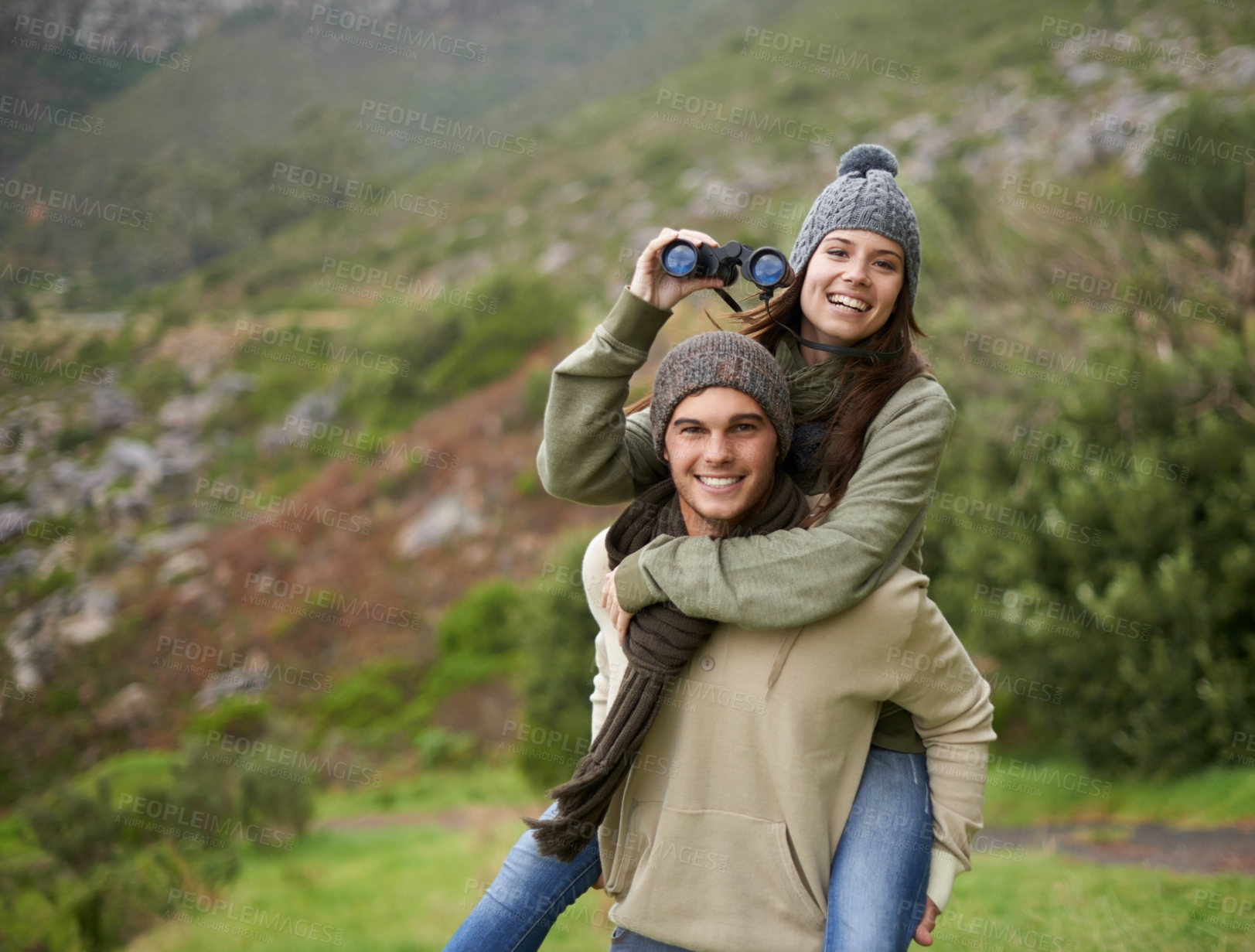 Buy stock photo Hiking portrait, binocular or happy couple on piggyback ride, have fun and enjoy mountain climbing journey in nature. Marriage, love or people bond on travel adventure, trekking or bird watching trip