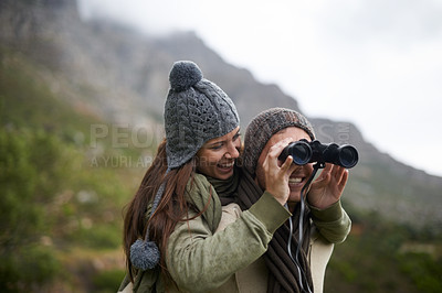 Buy stock photo Happy couple, binoculars in nature and mountains for travel journey, adventure and hiking or explore together. Man and woman trekking for outdoor search, vision or birdwatching lens of winter tourism