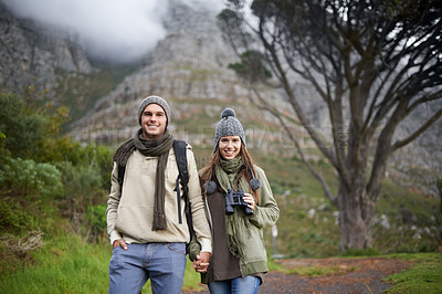 Buy stock photo Couple, portrait and hiking on mountain or holding hands with travel, adventure or holiday for experience or love. Man, woman and trekking outdoor on trail for cardio, exercise or happy and binocular