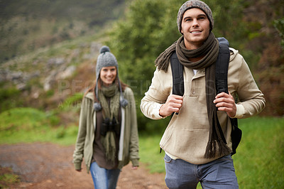 Buy stock photo Couple, smile and hiking in forest or nature with travel, adventure or holiday for experience or fitness. Man, woman or trekking outdoor in woods for cardio, exercise or workout with care or backpack