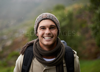 Buy stock photo Portrait of a handsome young man standing in the mountains