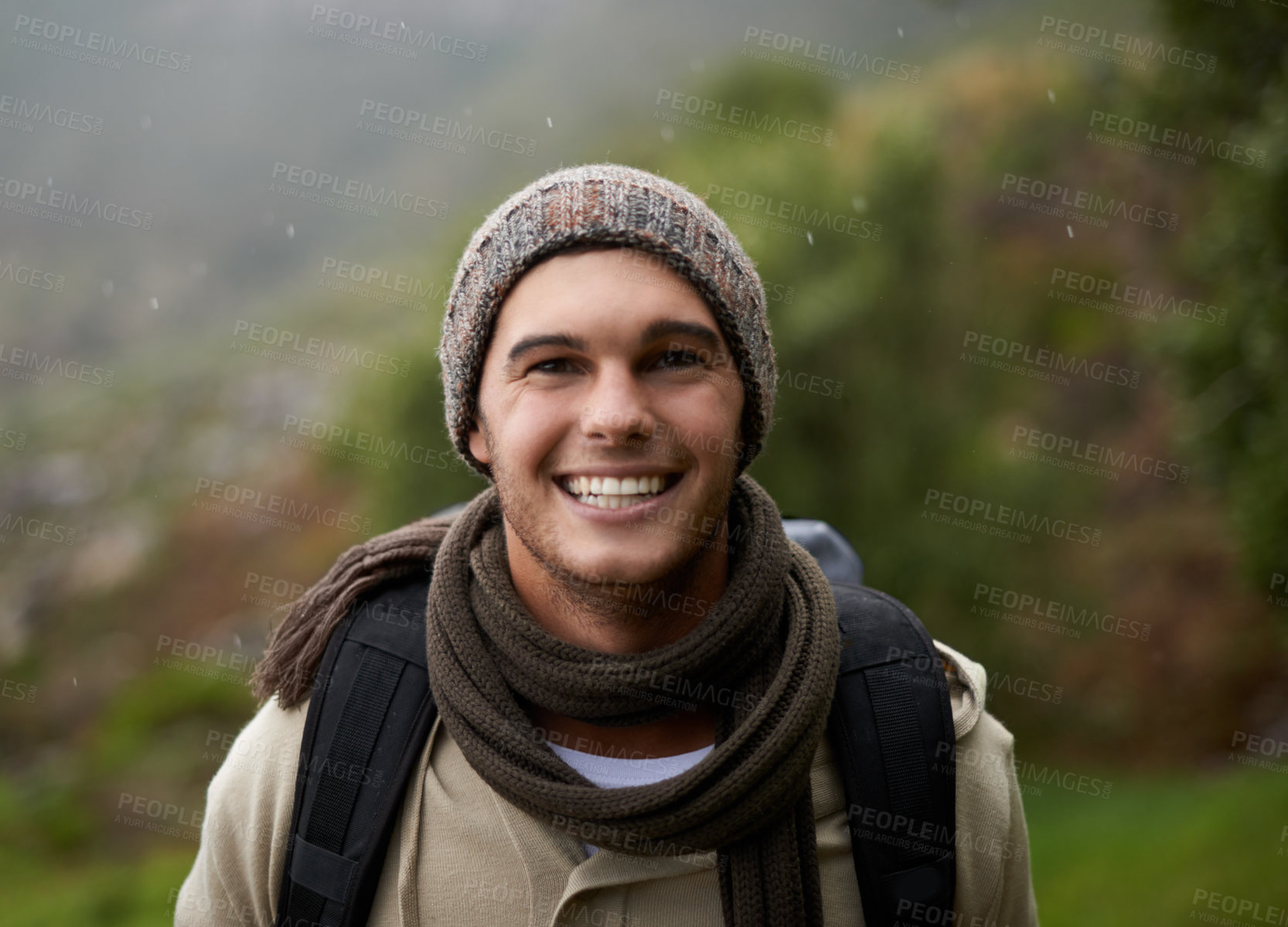 Buy stock photo Portrait of a handsome young man standing in the mountains