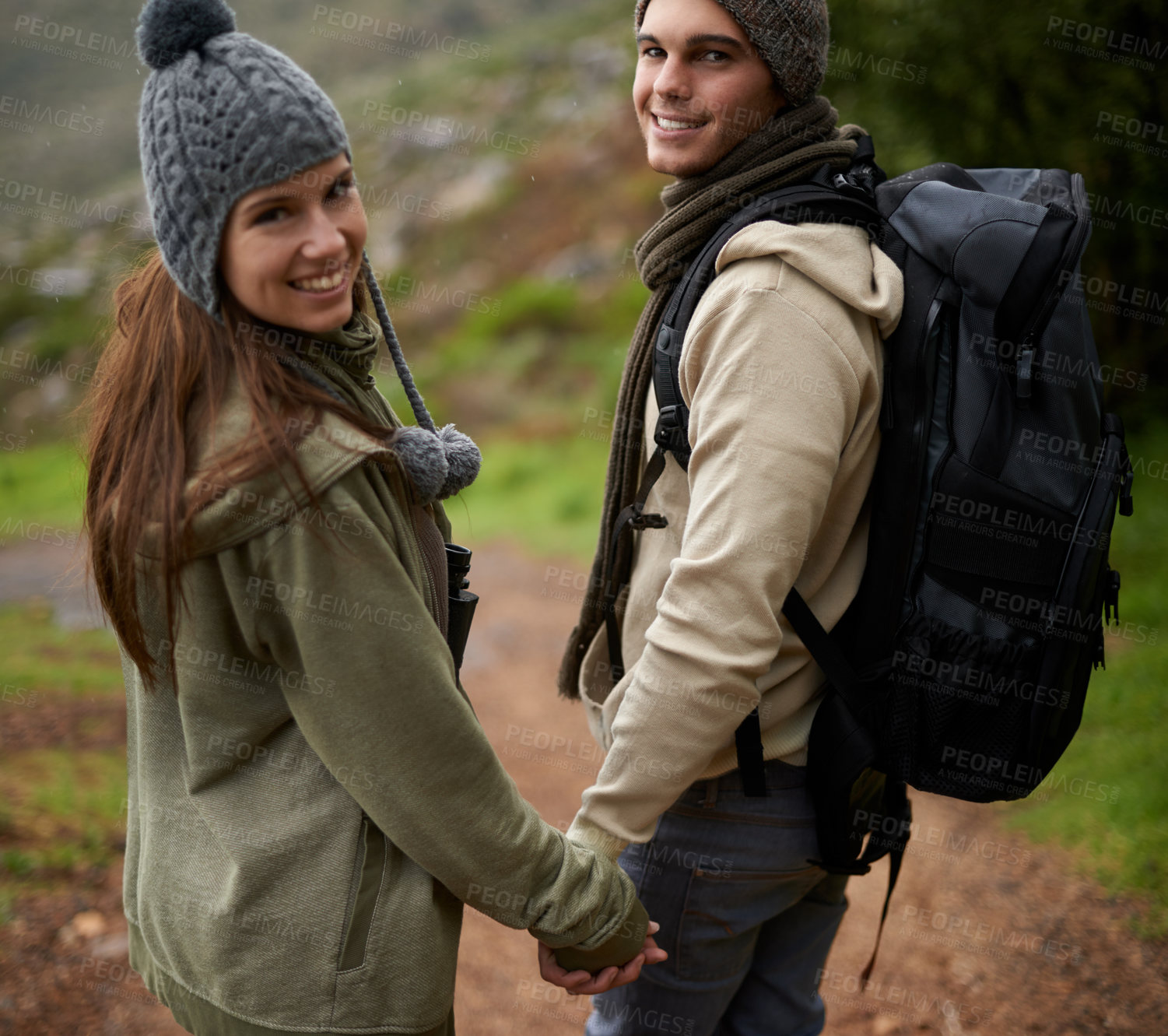 Buy stock photo Happy couple, trekking on mountains and holding hands for outdoor adventure, travel journey and portrait. Young man and woman with love, eco friendly date and walking or hiking in backpack for winter