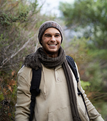 Buy stock photo Portrait of a handsome young man hiking in the mountains