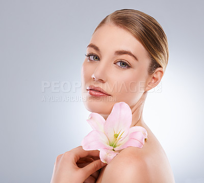Buy stock photo Portrait, beauty and woman with skincare, flowers and wellness on white studio background. Face, person and model with natural cosmetics and grooming with shine and glow with aesthetic or dermatology